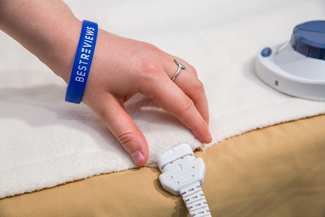 Person plugging in electric blanket