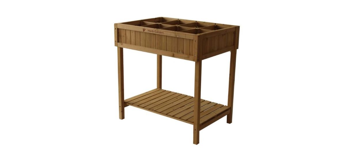 a wooden cart-style herb garden, with a shelf on the bottom and 8 square compartments on the top